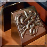 D11. Caduceus bookends. 